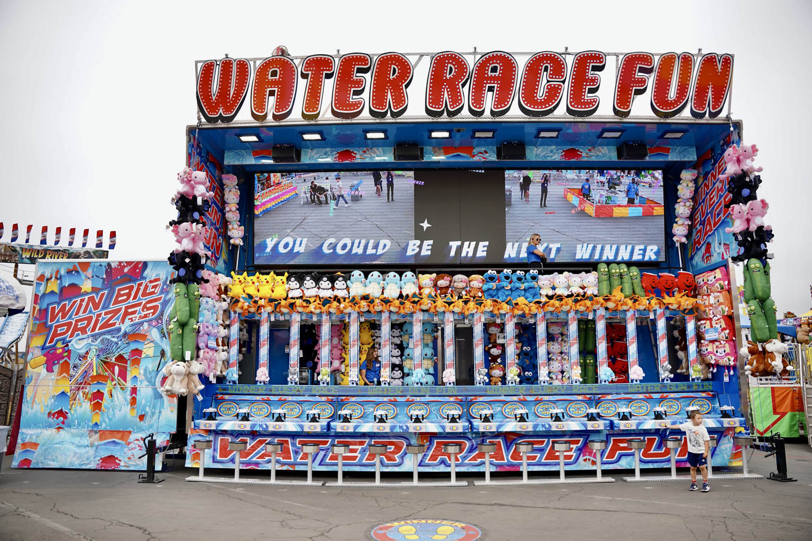 Colorful Water Race game booth at fair