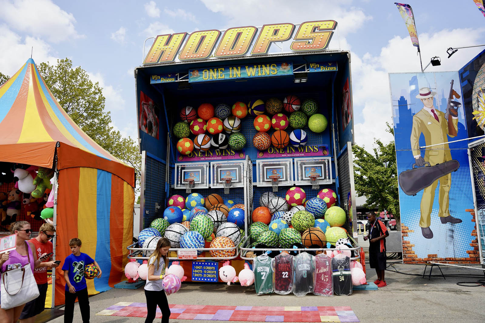 Hoops carnival basketball game with prize display