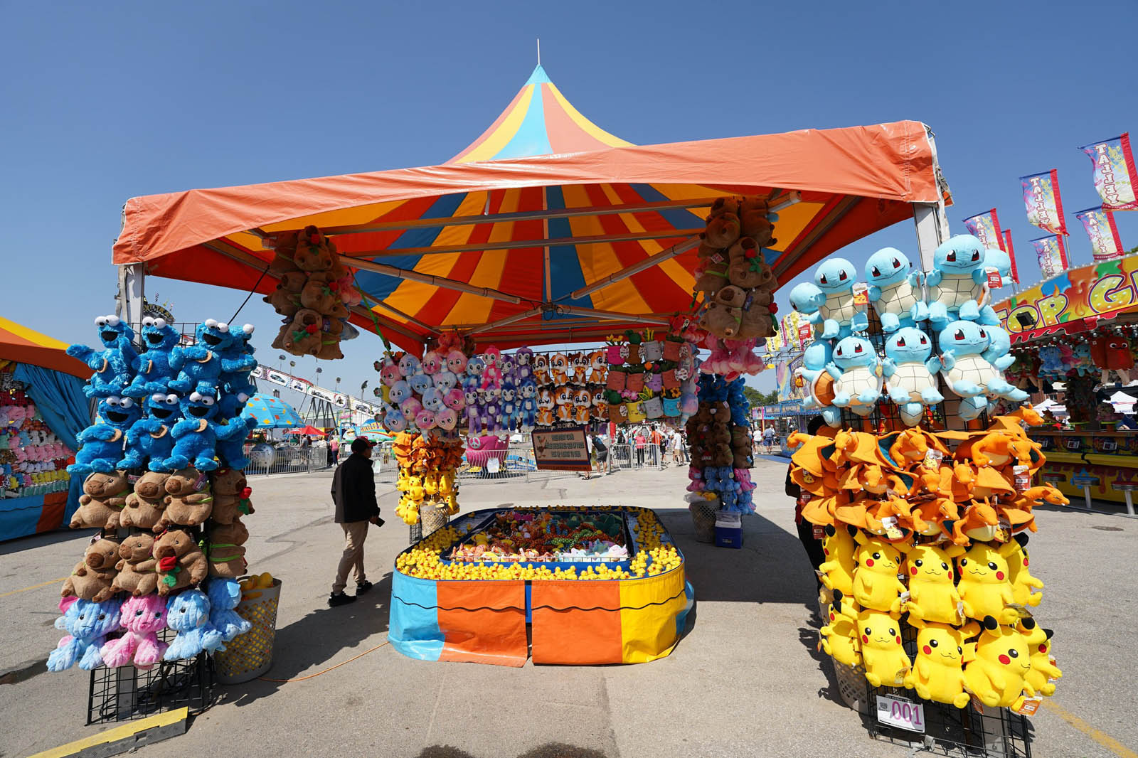 Carnival Duck Pond game with prize display