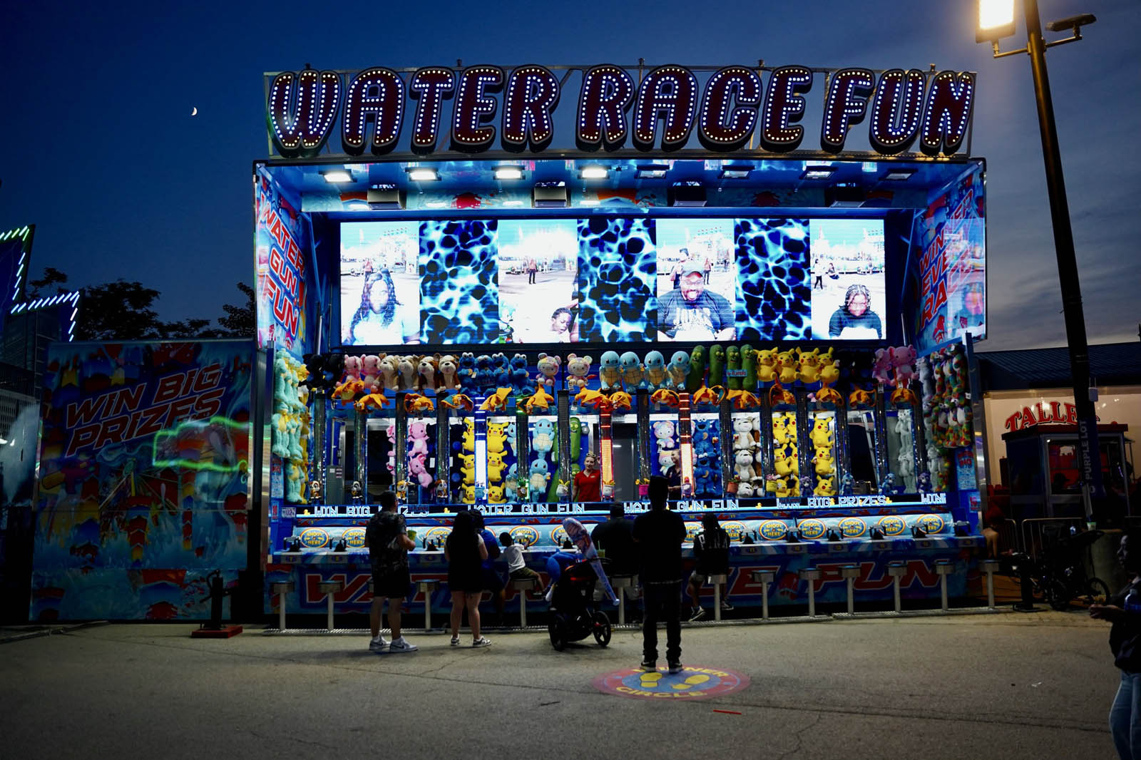 Classic water racing game with prizes on display