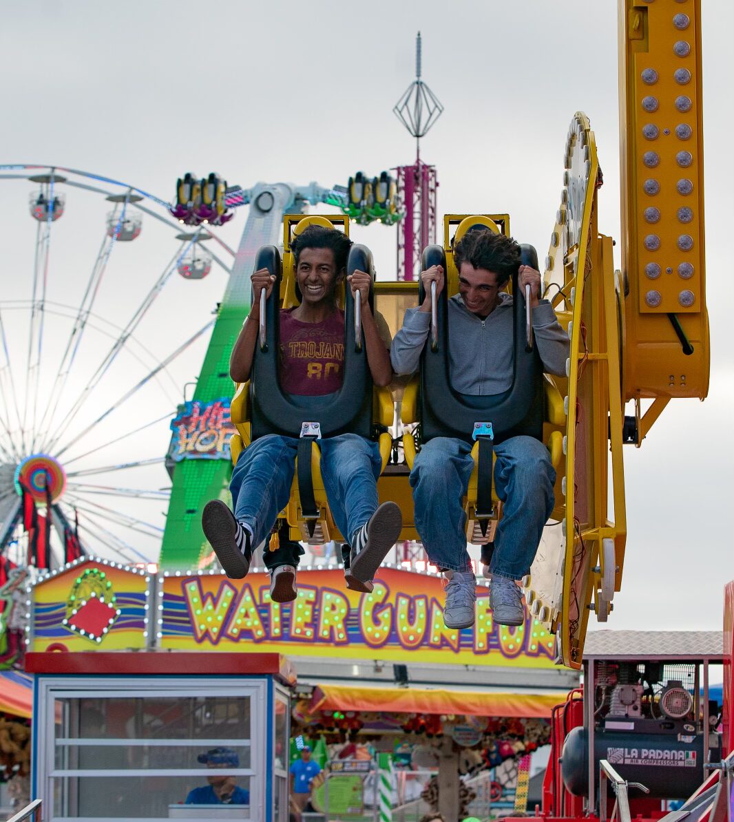 Festival guests ride The Defender at Talley Amusements
