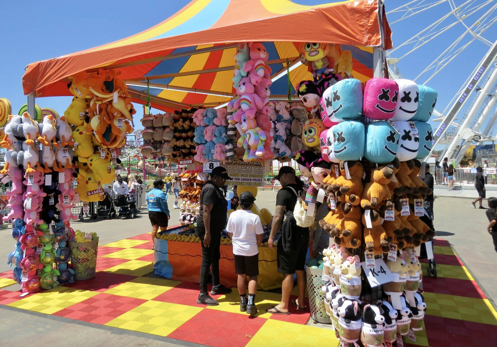 Children playing Duck Pond game at the midway