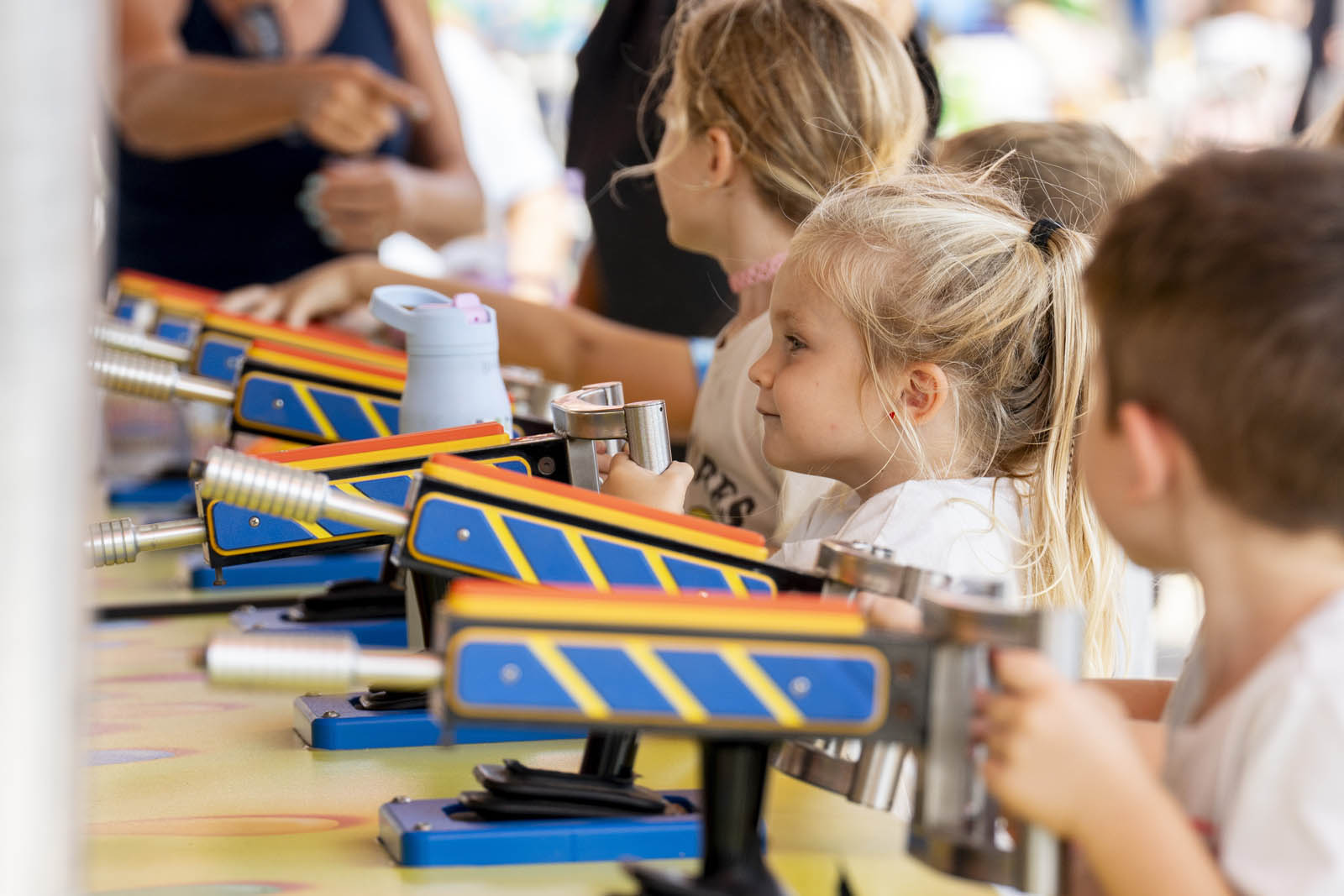 Children playing a prize game on the Talley Amusements midway