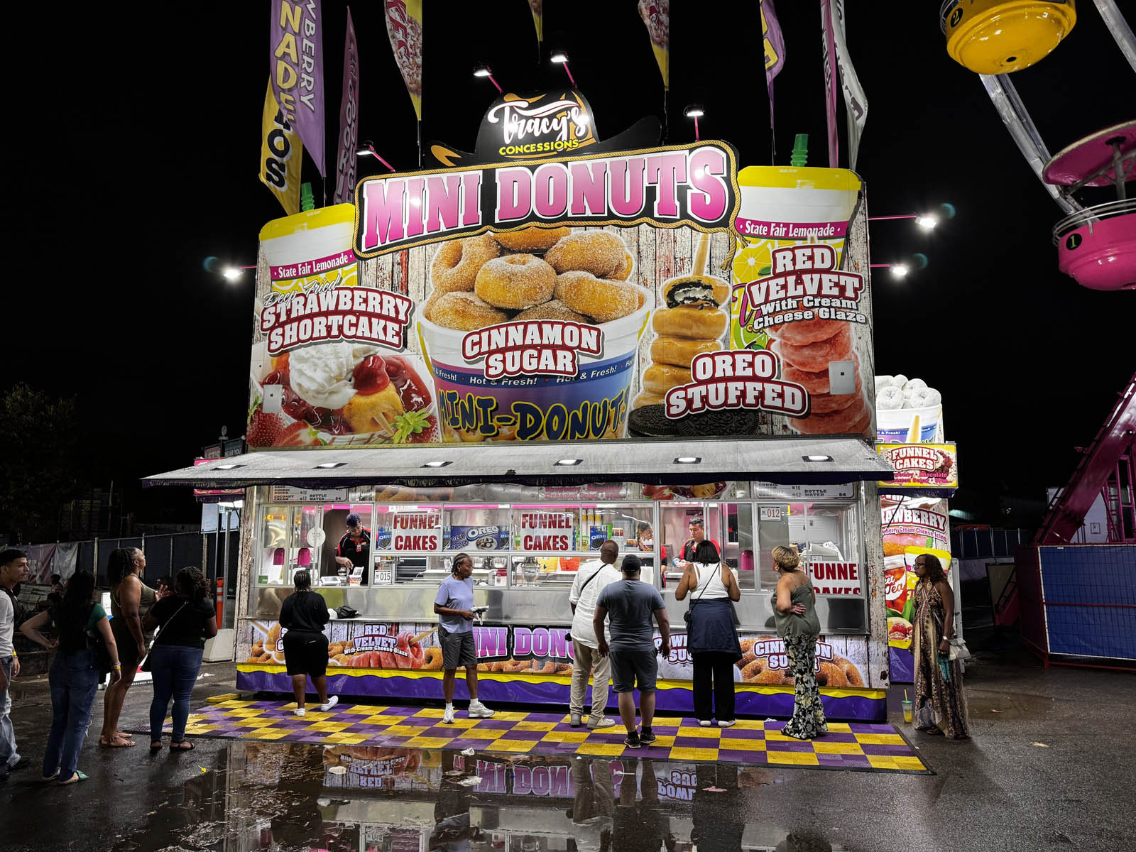 Fresh mini donuts with cinnamon sugar at carnival stand