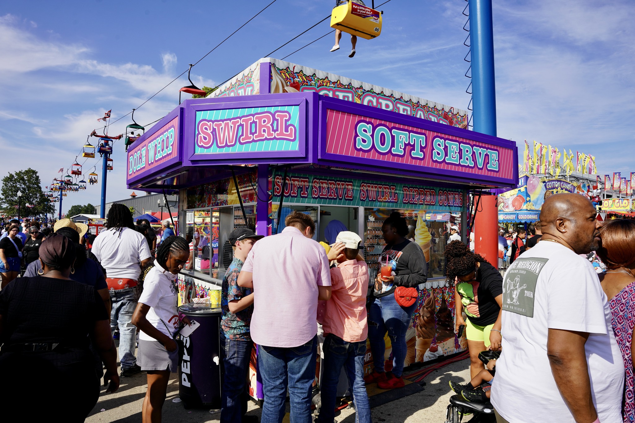Guests enjoying ice cream cones on the midway