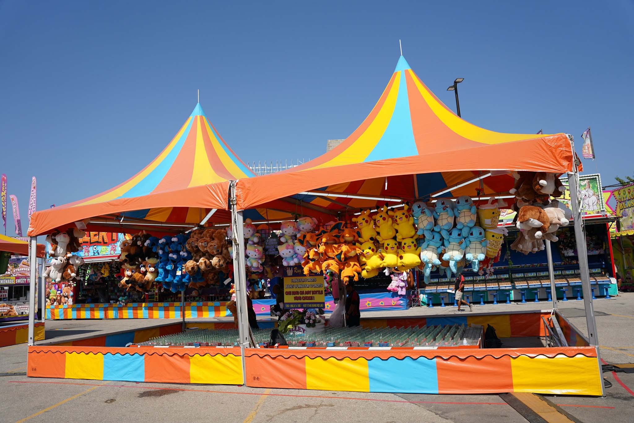 Ring-a-Bottle carnival game with rows of bottles