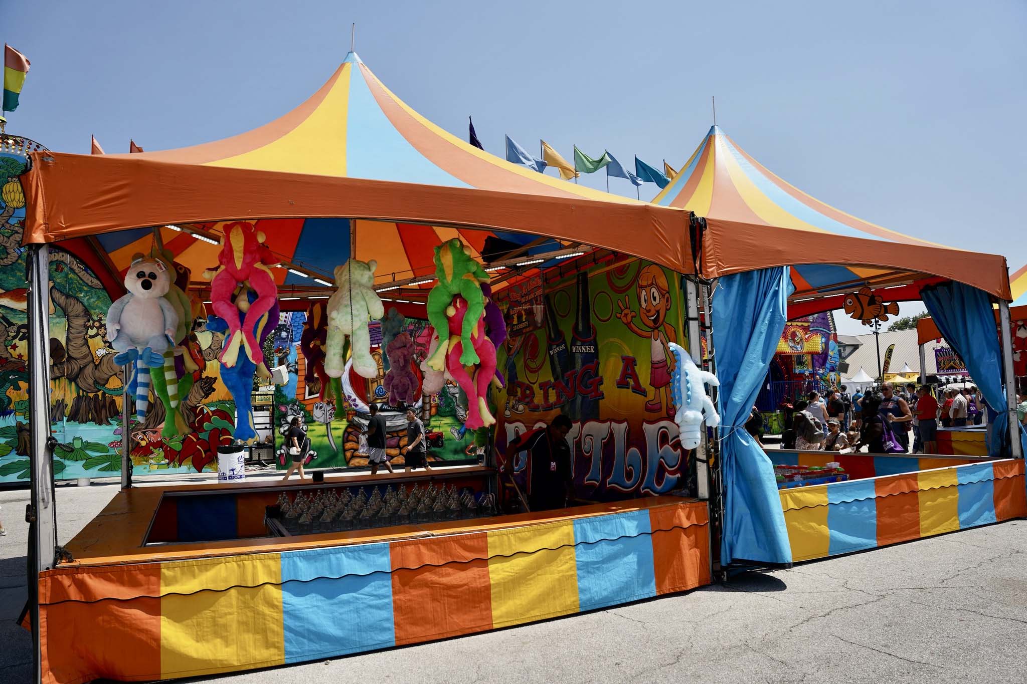 Classic ring toss game booth on the midway