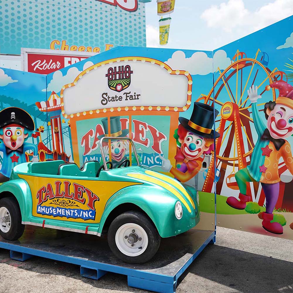 Take a photo at Talley's kid-sized car displays